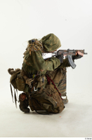  Photos John Hopkins Army Postapocalyptic Suit Poses aiming the gun kneeling whole body 0006.jpg